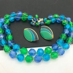 254.00 USD Vintage blue green, beaded high end, jewelry set, 1950's 1960's jewelry, mid century jewelry, beaded jewelry set, collectible necklace earring set Very nice colorful jewelry set in very good vintage condition. The necklace measures 17 1/2 inches long and the earrings are 1 1/2 x 1 inch. A very nice-looking married set and a great addition to any outfit or jewelry collection. #vintage #blue #green #multistrand #2strand #necklace #earrings #jewelryset d4 1970 Vintage Minnie Mouse Green Clothing Necklace, Retro Jewelry With Faceted Beads, Vintage Turquoise Jewelry With Colorful Beads, Vintage Green Jewelry With Faceted Beads, Blue Mid-century Jewelry For Formal Occasions, Mid-century Green Formal Jewelry, Mid-century Blue Formal Jewelry, Retro Blue Beaded Jewelry, Blue Beaded Retro Jewelry