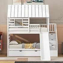 a white bunk bed sitting next to a dresser