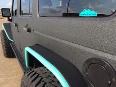 there is a blue sticker on the side of a black jeep that says, i'm level six