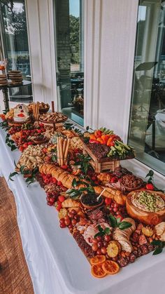 a long table covered in lots of different types of food