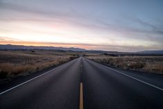 an empty road in the middle of nowhere