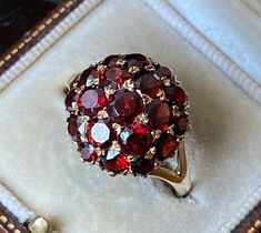 This item measures approximately :- U.K. size - 'R' U.S. size - '9' The ring face measures approximately 1.3cms in diameter.   It weighs approximately - 3.22gms. It is a fabulous vintage 375 9ct garnet gemstone studded bombe ring.  A stunning unusual brutalist/modernist statement ring.  Fully English hallmarked for 375 9ct gold date mark for 1966. Please see photos for a more accurate description. Wear and tear expected on an antique/vintage item.  Box in photographs not included in the sale. Bombe Ring, Jewel Makeup, Garnet Ring Vintage, Vintage Jewelry Repurposed, The Ring Face, Garnet Jewelry, Ruby Jewelry, Gemstone Studs, Pretty Rings