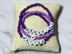 "Memories Matter" Alzheimer's & Dementia Awareness Bracelet Trio Set Awareness Month: June  Awareness Color: Purple 💜  Show support & raise awareness with this "Memories Matter" bracelet set, designed to honor those affected by Alzheimer's & Dementia. Each bracelet in this heartfelt set features glass seed beads in shades of purple, symbolizing awareness & support. This "Memories Matter" set is a gentle reminder of the importance of memories & the strength of those who cherish them. Whether you Bracelet Trio, Alzheimers Awareness, Awareness Bracelet, Invisible Illness, Alzheimers, Shades Of Purple, Bracelet Set, Arm Band, Color Purple