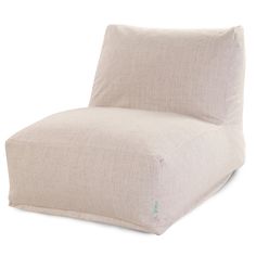 a white chair that is made out of fabric and has a pillow on the back