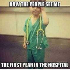 a little boy in green scrubs with a stethoscope on his head