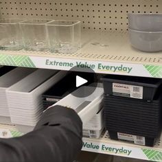 a person is looking at empty glasses on the shelf