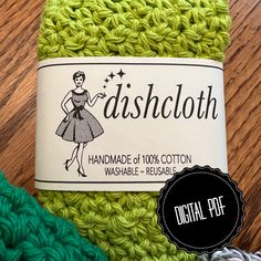 the dishcloth is green and has a label on it that says, handmade of 100 % cotton