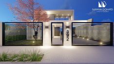 the front entrance to a modern home at night