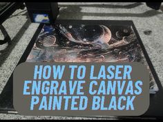 a table with an advertisement on it that says how to laser engraving canvass painted black