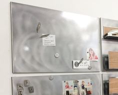 a refrigerator with magnets and pictures on the front, along with other magnets