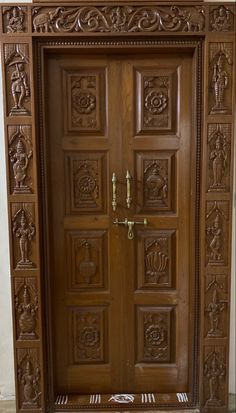 a wooden door with intricate carvings on it