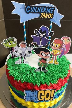 a birthday cake decorated with cartoon characters on it's top and the words, culherme zanos