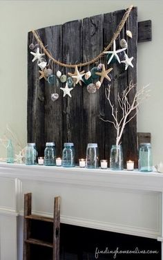 a table topped with blue glass bottles filled with starfish