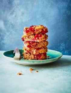 a stack of granola bars sitting on top of a blue plate