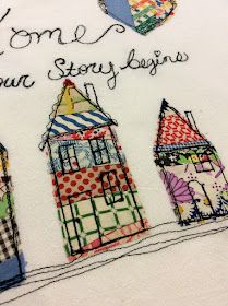 three houses are embroidered onto a white t - shirt with the words home is where your story begins