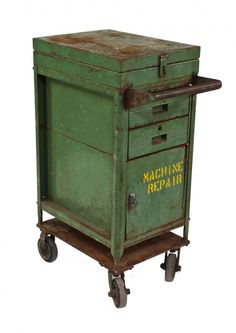 an old green metal cabinet on wheels