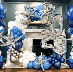 the number twenty five is surrounded by balloons and starbursts in blue, white and silver