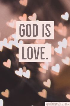 the words god is love written on a blurry background with hearts in the foreground