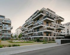 an apartment building with balconies on the top floor and balconies on the second floor