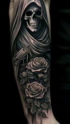 a person with a skull and roses on their arm