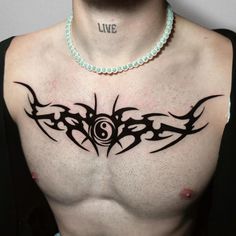 a man with a tattoo on his chest