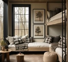 a bedroom with bunk beds, pillows and pictures on the wall next to each other