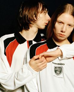 two young people standing next to each other