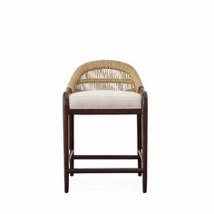 an image of a wooden chair with wicker back and white seat pad on it