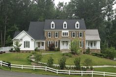 a large brick house with white trim and windows