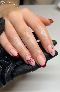 burgundy festive french tip nails with bows and stars #biab #gelnails #frenchtips #burgundynails #christmasnails #festivenails #nailinspo #christmasnailinspo #bows #stars #glitter Bows On Nails Christmas, Christmas French Acrylic Nails, Red And Gold Bow Nails, Red French Holiday Nails, Red Bow French Tip Nails, Bow Nails With French Tip, Bow On Nails Design, Christmas Nails Red With Bow, Simple Nail Ideas Christmas