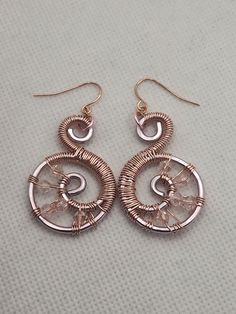 Introducing our stunning Handmade Rose Gold Swirl Drop Earrings! Crafted with love from tarnish-resistant aluminum wire, these elegant earrings feature a mesmerizing swirl design, adding a unique touch to any outfit. The hypoallergenic stainless steel ear wires ensure all-day comfort, even for sensitive ears. Lightweight yet durable, these earrings are perfect for everyday wear or special occasions. Elevate your accessory game with this chic, handcrafted pair! Elegant Swirl Earrings With Ear Wire, Elegant Swirl Wire Wrapped Earrings, Handmade Swirl Metal Earrings, Swirl-shaped Earrings With Ear Wire, Nickel-free Rose Gold Copper Wire Earrings, Handmade Rose, Swirl Design, Sensitive Ears, Elegant Earrings