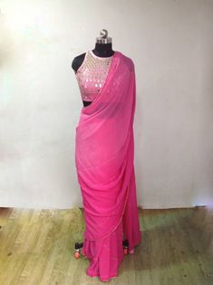 Graded pink ( light to dark) georgette embroidery saree with beautiful zardosi embroidery lines. Blouse is available as a seperate listing. The saree can be made in other colors as well Blouse: https://www.etsy.com/listing/957833251/custom-fit-graded-pink-mirror-work Pink Cutdana Pre-draped Saree For Party, Pink Chinon Pre-draped Saree For Navratri, Designer Pink Pre-draped Saree With Zari Work, Festive Pink Pre-draped Saree With Dori Work, Pink Pre-draped Saree With Unstitched Blouse For Festivals, Pink Party Wear Pre-draped Saree With Mirror Work, Pink Saree With Gota Work, Pink Pre-draped Saree With Gota Work For Navratri, Pink Chanderi Pre-draped Saree For Reception