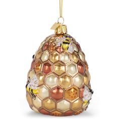 an ornament shaped like a honeycomb with two bees on the front and one bee on the back