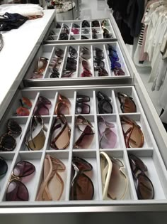 an open drawer with several pairs of shoes in it and the caption says, jewelry trays are customized to fit all sizes