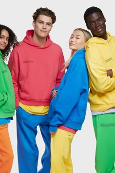 three men and two women in bright colored sweat suits