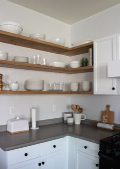 the kitchen is clean and ready to be used for dinner or desserts on the shelves