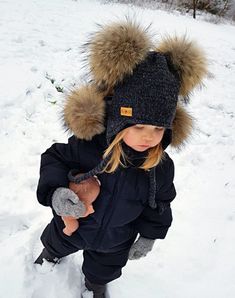 Cute and warm Merino wool winter hat for your little ones! Knitted pom pom hat. All our knitted hats are with 100% cotton lining so it's perfect for winter. Wind resistant and the head is not sweating. Because of the lining hats don't stretch and keep its shape. Material: 100% Merino wool Lining: 100% cotton Pom pom: Natural fur Hand knit Fur pom color can be a bit different because fur is natural. Sizes available: 0-3 months old (38/40 cm.) 3-6 months old (42/44 cm.) 6-12 months old (46/48 cm.) Playful Winter Bonnet Cap, Winter Beanie With Pom Poms, Cute Warm Bonnet For Winter, Warm Cute Bonnet For Winter, Cute Warm Winter Bonnet, Winter Hat With Pom Poms For Cold Weather, Cute Warm Winter Beanie, Warm Crochet Hat With Ear Flaps For Winter, Cute Warm Crochet Hat For Winter