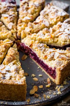 a close up of a pie on a pan with one slice cut out and ready to be eaten