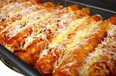 a pan filled with cheesy pizza on top of a stove