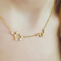 Channel the magic of the stars with our Zodiac Constellation Necklace in 14k Gold. This elegant necklace captures the beauty of your zodiac sign's constellation in a delicate design, adorned with sparkling stones that mimic the stars. A perfect piece for astrology lovers, this celestial necklace adds a unique and personal touch to your style, making it a thoughtful gift or a cherished addition to your jewelry collection. Materials: Meticulously crafted from high-quality 14k Gold, this constellat Astrology Jewelry, Celestial Necklace, Constellation Necklace, Pendant For Women, Zodiac Constellations, Elegant Necklace, Delicate Design, Necklace Dainty, Elegant Necklaces