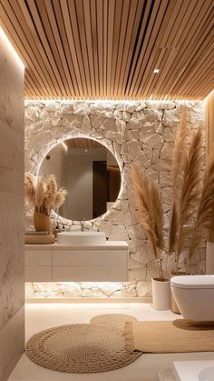 a modern bathroom with stone walls and flooring