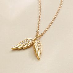 "This is a beautiful dainty necklace you will cherish for years to come and pass down for generations. It will also make a perfect gift for loved ones. Please note that this is a small and delicate necklace. ♥ D E T A I L S ⚬ Crafted with 14K pure Yellow Gold 100% guaranteed (Water-Resistant, Tarnish-Resistant, and Hypoallergenic) ⚬ Pendant Height: 14.5 mm ⚬ Pendant Width: 6 mm each wing ⚬ Diamond Carat and Clarity: G-H, SV1 ⚬ Diamond Weight: 0.03 carat ⚬ Chain Passage Dimensions: 2.5mm ⚬ Chain: Angel Wings Pendant, Diamond Angel, Libra Necklace, Delicate Gold Jewelry, Wings Pendant, Angel Wing Pendant, Fine Gold Jewelry, Bamboo Earrings, Fine Diamond Jewelry