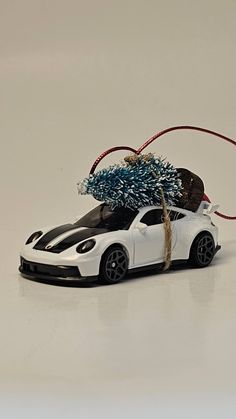 a toy car with a christmas tree on top