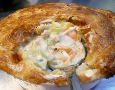 a close up of a pie with a spoon in it