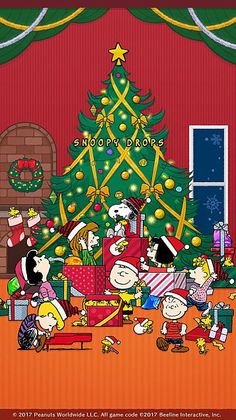 the peanuts christmas tree is decorated with presents and other holiday decorations, as well as snoop's family around it