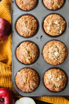 apples and muffins in a muffin tin