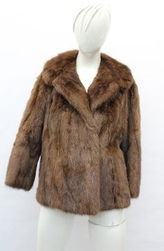 DESCRIPTION: BROWN MUSKRAT FUR JACKET!  THE COLLAR TYPE IS "NOTCH", IT CLOSES WITH HOOK & EYE CLOSURE AND HAS TWO SIDE POCKETS. THIS ITEM IS SCRAP: THE FUR IS DAMAGED BUT THE GOOD PART CAN BE USED FOR FUR ACCESSORY PROJECT! MEASUREMENTS:   SIZE: N/A LENGTH: 23"  SLEEVES: 25"; VERY SHORT LENGTH; MEASURED FROM THE SIDE OF THE NECK TO THE CUFF. b4462 Oliverfurs 9250 Parc Ave. #204, Montreal, Quebec, H2N 1Z2, Canada www.oliverfurswholesale.com oliver@oliverfurswholesale.com Toll free: 1-866-845-9997 Raccoon Fur Coat, Sheepskin Jacket, Fur Accessories, Montreal Quebec, Brown Coat, Hook Eye, Men's Coats And Jackets, Fur Jacket, Jacket Coat