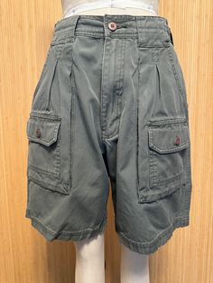 These great-looking vintage shorts feature multiple pockets front and back, a high rise and zip fly. No labels whatsoever.  Very good vintage condition. Feels like cotton or cotton blend.  Detailed Measurements: Waist - 28 inches  Hip - 39 inches  Rise - 12 inches  Inseam - 7.5 inches Utility High-waisted Shorts With Patch Pockets, Utility Shorts With Pockets, Utility Relaxed Fit Shorts With Pockets, Utility Shorts With Pockets And Relaxed Fit, Relaxed Fit Utility Shorts With Pockets, Vintage Cotton Cargo Shorts With Pockets, High-waisted Cotton Shorts With Pockets, Utility High-waisted Cargo Shorts With Patch Pockets, High-waisted Utility Cargo Shorts With Patch Pockets