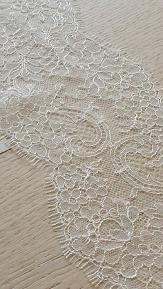 60 cm piece of Ivory lace Trim, Chantilly Lace, French Lace trim, Bridal lace, Wedding Lace, Scalloped lace, Lace Fabric, Fabric by the yard MB00249 Article: MB00249 Colors: Ivory Style: French Width: 12 cm, listed for 60cm (60 cm x 12 cm) Sold per last piece 60cm (60 cm x 12 cm) If you need a different amount, please contact us. Soft and romantic. Perfect for weeding dress,  accessories, veil. Very stunning and elegant! Limited stock. IMPORTANT: Please note, there might be a slight difference i White Lace Trim For Wedding, Off White Lace With Lace Trim For Wedding, Ecru Lace With Lace Trim For Wedding, Beige Wedding Lace With Lace Trim, Elegant White Lace With Contrast Detailing, Wedding Lace, Chantilly Lace, Lace Weddings, Scalloped Lace