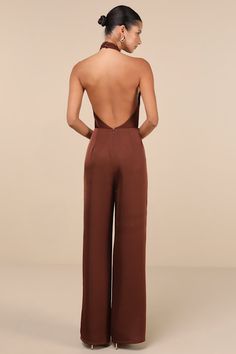 The Lulus Beyond Classy Brown Satin Halter Wide-Leg Jumpsuit is perfect for a night of bubbly and dancing! Sleek woven satin shapes this sensational jumpsuit that has a halter neckline (with button closures) and a sleeveless, cross-front bodice with a flirty keyhole cutout at the front and a sexy backless design. The fitted waist tops trendy, wide pant legs that fall to ankle-length hems. Hidden back zipper/clasp. Fit: This garment fits true to size. Length: Floor length. Size medium measures 66 Elegant Jumpsuits For Women, Rehearsal Dinner Guest, Future Husband Journal, Husband Journal, Jumpsuit Wedding Guest, Rehearsal Dinner Outfits, What Is Trending Now, Halter Neck Jumpsuit, Satin Jumpsuit